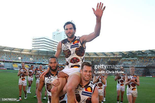 Jordan Lewis of the Hawks is chaired from the field after his 250th match during the round 10 AFL match between the Brisbane Lions and the Hawthorn...