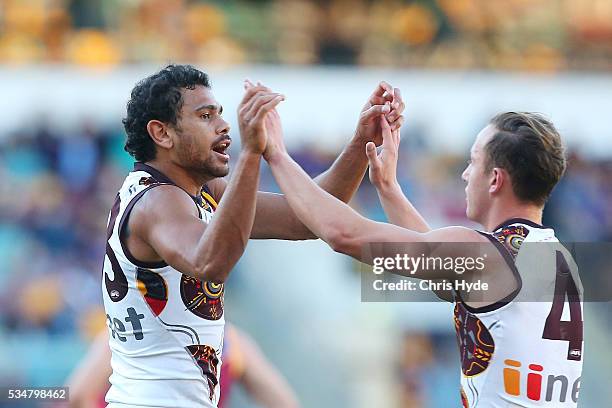 Cyril Riolo of the Hawks celebrates a goal during the round 10 AFL match between the Brisbane Lions and the Hawthorn Hawks at The Gabba on May 28,...