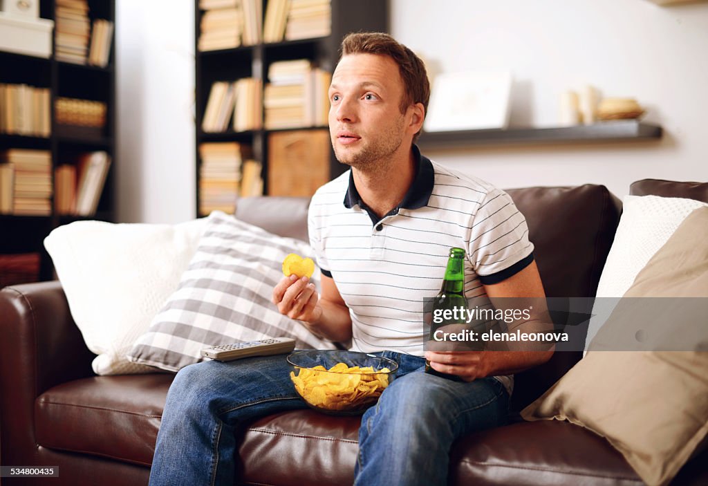 Young man in home interior