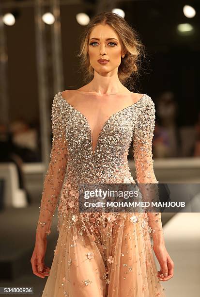 Model displays a creation by Lebanese designer Antoine Salameh during the launch of the 4th edition of the Ladies a La Mode fashion show, on May 27...