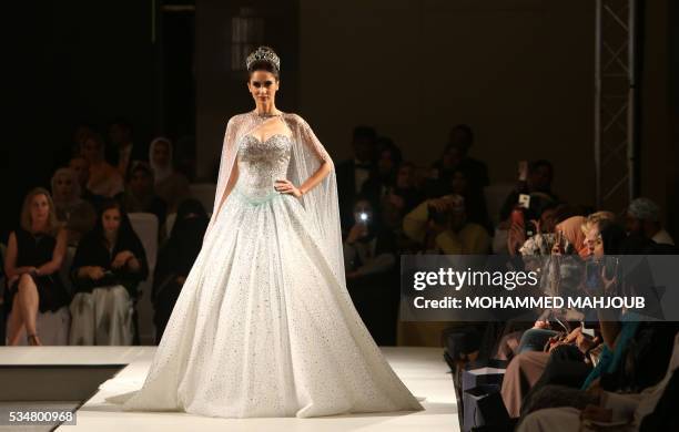 Model displays a creation by Lebanese designer Antoine Salameh during the launch of the 4th edition of the Ladies a La Mode fashion show, on May 27...