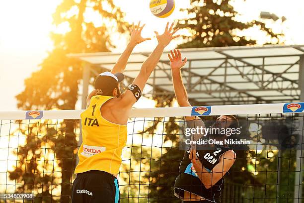 Paolo Nicolai of Italy and Ben Saxton of Canada duel at the net during a game between Italy and Canada on day 4 of the FIVB Moscow Grand Slam on May...