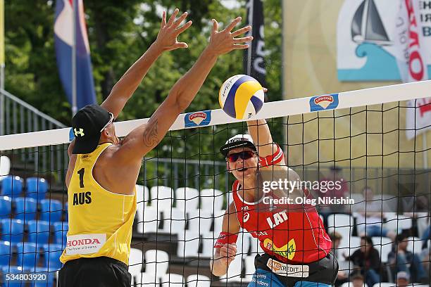 Isaac Kapa of Australia' blocks an attack of and Janis Smedins of Latvia during a game between Latvia and Australia on day 4 of the FIVB Moscow Grand...