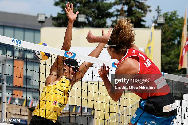 Isaac Kapa of Australia' blocks an attack of and Aleksandrs Samoilovs of Latvia during a game between Latvia and Australia on day 4 of the FIVB...