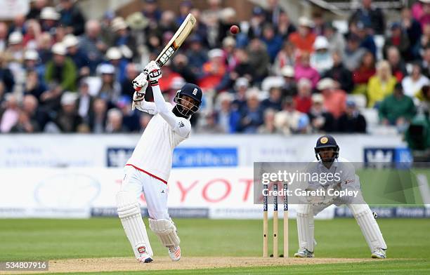 Moeen Ali of England bats watched by Sri Lankan wicketkeeper Kusal Mendis during day two of the 2nd Investec Test match between England and Sri Lanka...