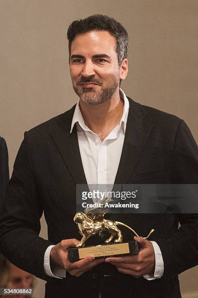 The representative of Spain receives the Golden Lion for Best National Participation at the official opening ceremony of the 15th Biennale of...