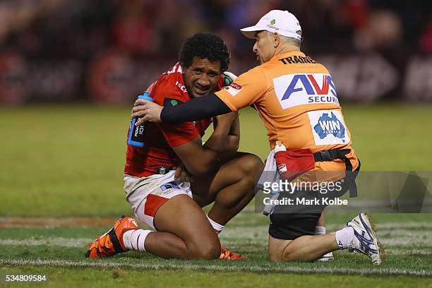 Kalifa Faifai Loa of the Dragons receieves attention from the trainer during the round 12 NRL match between the St George Illawarra Dragons and the...