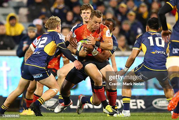 Riaan Viljoen of the Sunwolves is tackled during the round 14 Super Rugby match between the Brumbies and the Sunwolves at GIO Stadium on May 28, 2016...