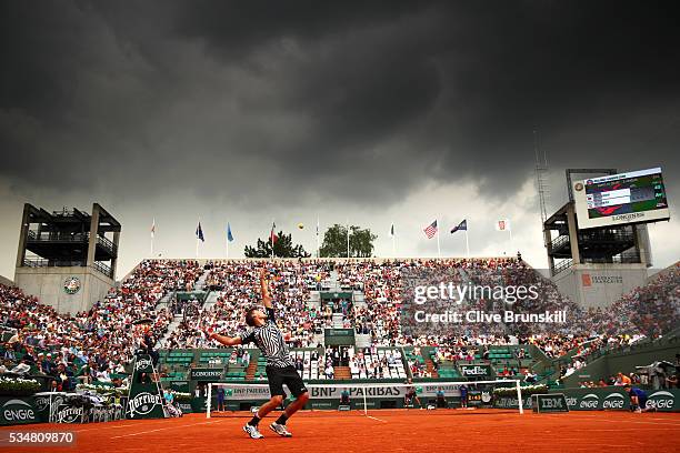 Dominic Thiem of Austria serves during the Men's Singles third round match against Alexander Zverev of Germany on day seven of the 2016 French Open...