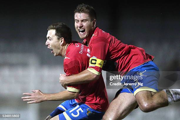 Raymond Miller and captain of the White Eagles, David Vrankovic celebrate a goal during the men's National Premier League match between Bonnrigg and...