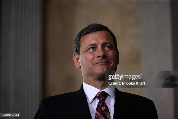 Chief Justice of the United States, John Roberts waits to administers the oath of office for the new Treasury Secretary Henry Paulson at the U.S....
