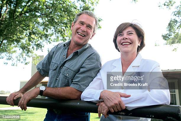 Republican presidential candidate George W Bush and his wife Laura on their Texas ranch.