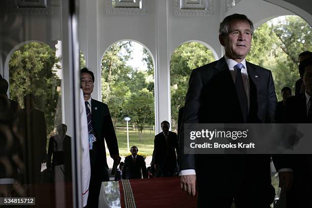 President George W. Bush arrives to meet with Vietnam's Prime Minister Nguyen Tan Dung at the Government Office in Hanoi. Bush is attending the...