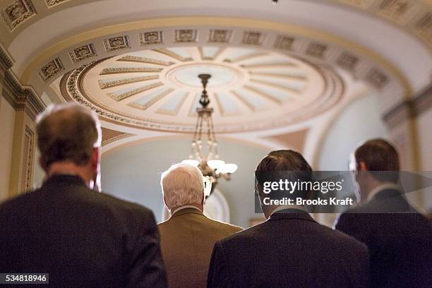 Republican Senators speak to the media on Capitol Hill in Washington. Congress and the White House are seeking a way to avoid a package of $85...