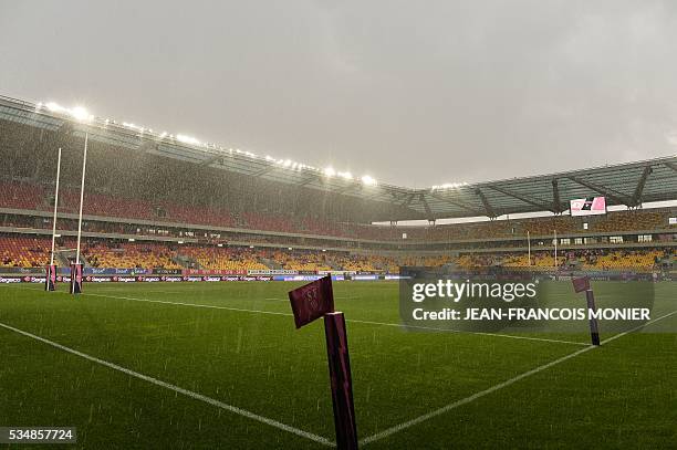 Heavy rain falls on the pitch at the MMArena Stadium in Le Mans, northwestern France, prior to the French Top 14 rugby union match between Agen and...