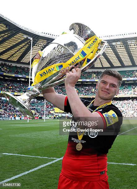 Owen Farrell of Saracens celebrates with the trophy after victory in the Aviva Premiership final match between Saracens and Exeter Chiefs at...