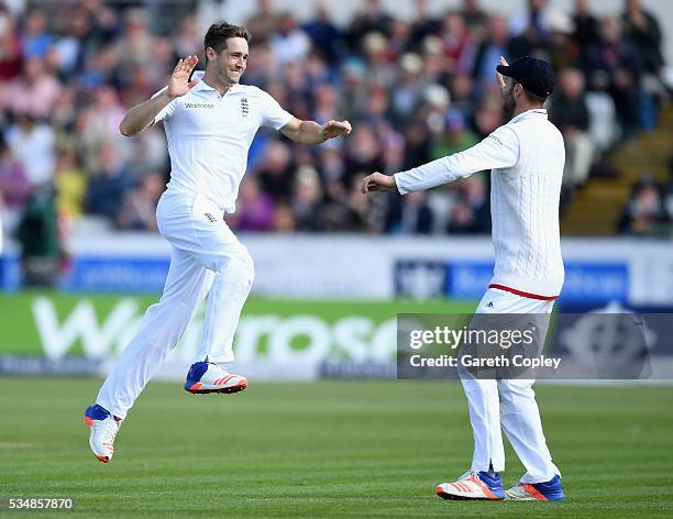 Chris Woakes of England celebrates with James Vince after dismissing Kusal Mendis of Sri Lanka during day two of the 2nd Investec Test match between...