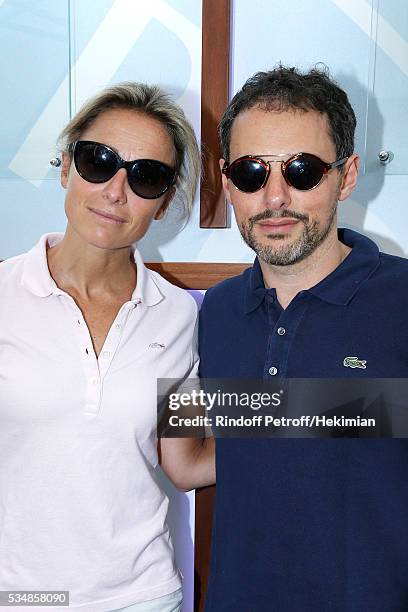 Journalists Anne-Sophie Lapix and Marc-Olivier Fogiel attend Day Seven of the 2016 French Tennis Open at Roland Garros on May 28, 2016 in Paris,...