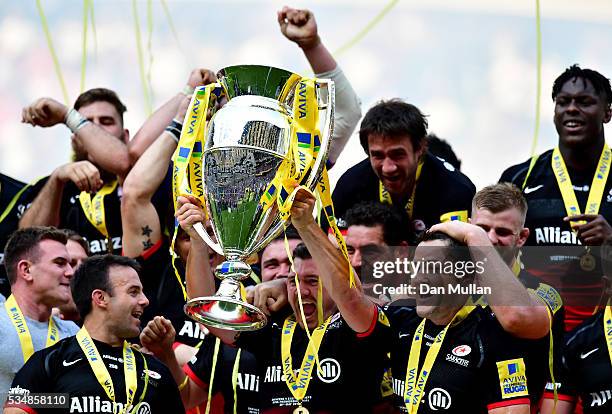 Brad Barritt of Saracens lifts the trophy after victory in the Aviva Premiership final match between Saracens and Exeter Chiefs at Twickenham Stadium...