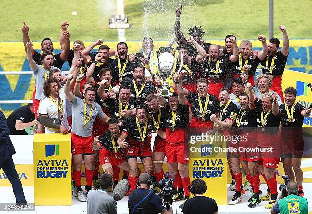 Brad Barritt of Saracens lifts the trophy after victory in the Aviva Premiership final match between Saracens and Exeter Chiefs at Twickenham Stadium...