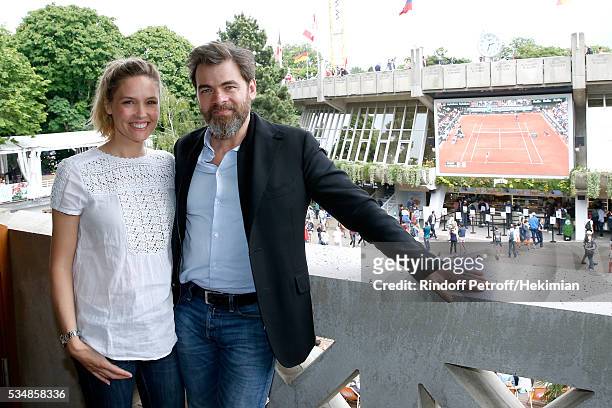 Actors Clovis Cornillac and his wife Lilou Fogli attend the 'France Television' Lunch during Day Seven of the 2016 French Tennis Open at Roland...