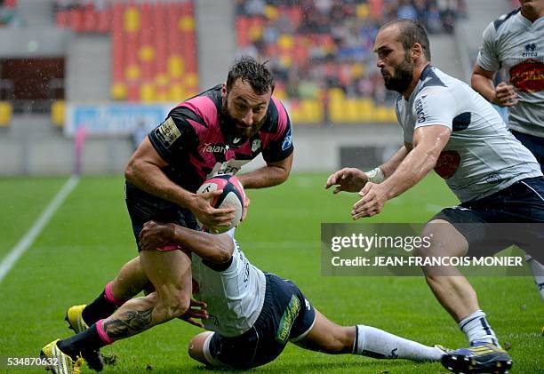 Stade Francais Paris' French wing Jeremy Sinzelle scores a try during the French Top 14 rugby union match between Agen and Stade Français on May 28,...