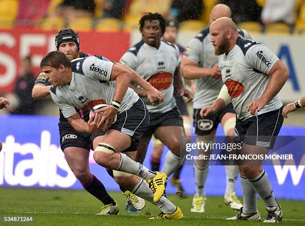 Agen's French flanker Antoine Miquel runs with the ball during the French Top 14 rugby union match between Agen and Stade Français on May 28, 2016 at...