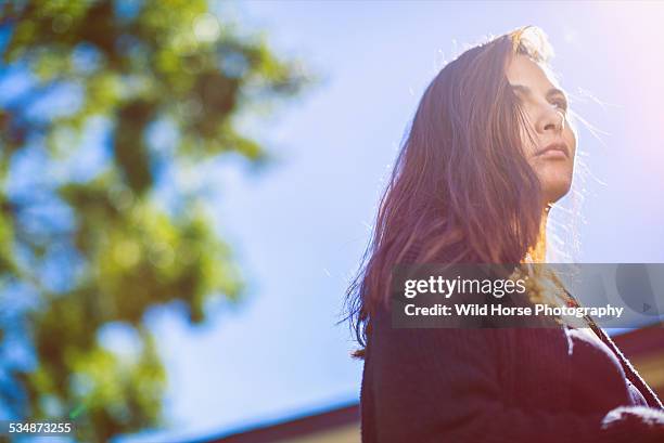 pretty woman looking away in the sun - san antonio texas stock pictures, royalty-free photos & images
