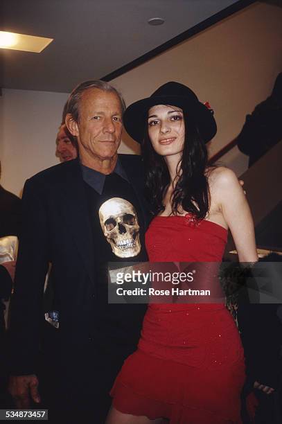 American artist, photographer, and writer Peter Beard with a friend at a gallery in Chelsea, New York City, USA, circa 1997.