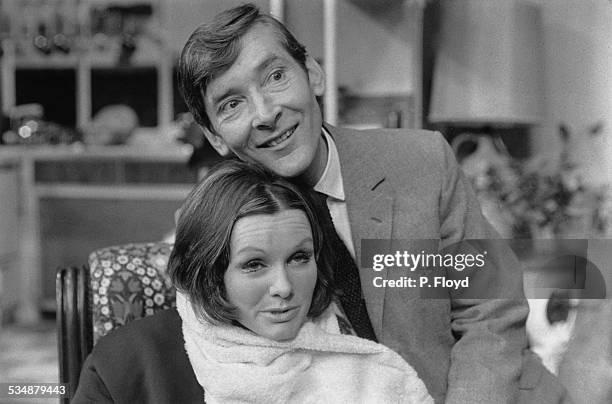 English comic actor and comedian Kenneth Williams and English actress Jennie Linden in a production of Charles Laurence's stage comedy 'My Fat...