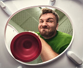 Man with cup plunger