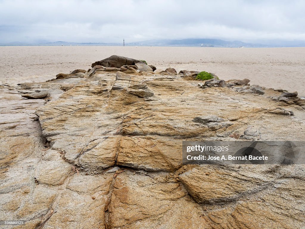 Formation of sandy rock eroded in a beach