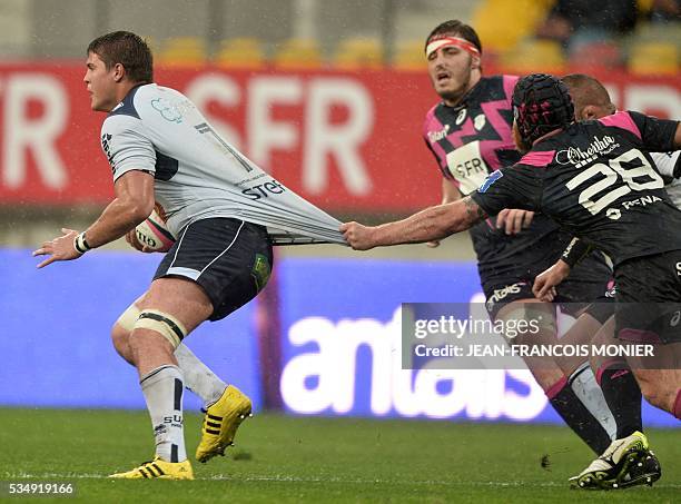 Agen's French flanker Antoine Miquel runs with the ball during the French Top 14 rugby union match between Agen and Stade Français on May 28, 2016 at...