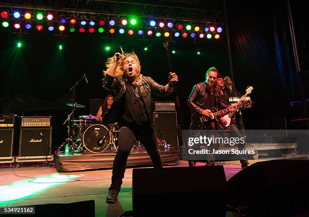 Musicians Andrew Freeman, Vivian Campbell, and Phil Soussan of Last In Line performs at Catch The Fever Festival Grounds on May 27, 2016 in Pryor,...