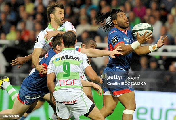 Grenoble's replacement Maritino Nemani handles the ball during the French Top 14 rugby union match between Pau and Grenoble at the Hameau stadium on...