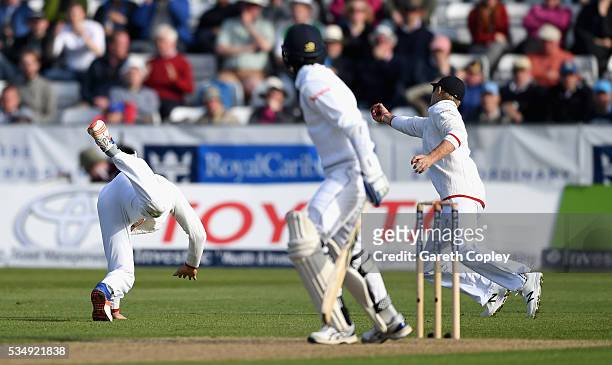 Joe Root of England catches out Shaminda Eranga of Sri Lanka after James Vince parries the ball during day two of the 2nd Investec Test match between...