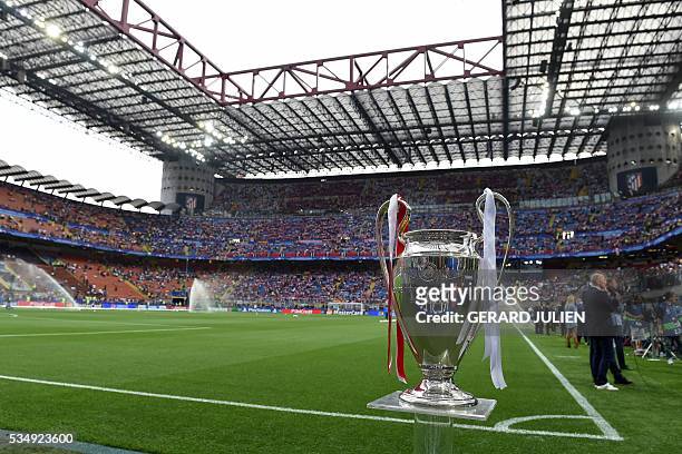 The UEFA Champions League trophy is on display ahead of the final football match between Real Madrid and Atletico Madrid at San Siro Stadium in...