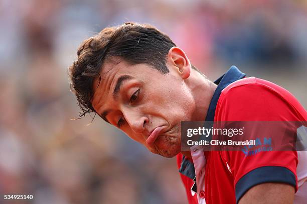 Nicolas Almagro of Spain reacts during the Men's Singles third round match against David Goffin of Belgium on day seven of the 2016 French Open at...