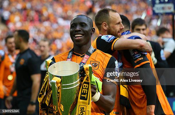 Mohamed Diame of Hull City celebrates with the trophy after victory in during Sky Bet Championship Play Off Final match between Hull City and...