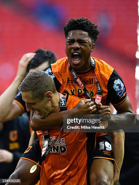 Michael Dawson and Chuba Akpom of Hull City celebrate winning the Sky Bet Championship Play Off Final match between Hull City and Sheffield Wednesday...