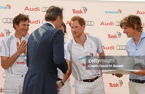 Team Audi Ultra members Luke Tomlinson, Andre Konsbruck, Director of Audi UK, Mark Tomlinson, Prince Harry and William Melville-Smith attend day one...