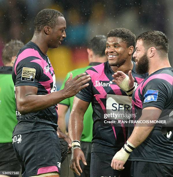 Stade Francais Paris' French scrumhalf Julien Dupuy, French centre Jonathan Danty and French hooker Laurent Sempere celebrate after winning the...