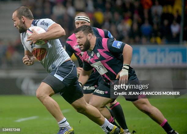 Agen's Georgian wing Tamaz Mchedlidze runs with the ball during the French Top 14 rugby union match between Agen and Stade Français on May 28, 2016...