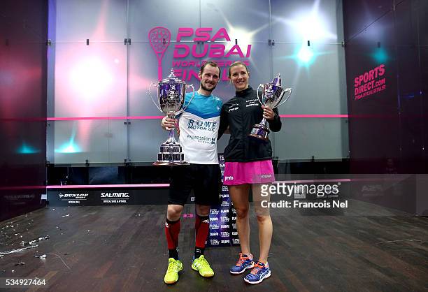 Gregory Gaultier of France and Laura Massaro of England pose with the winners trophys after the PSA Dubai World Series Finals 2016 at Burj Park on...