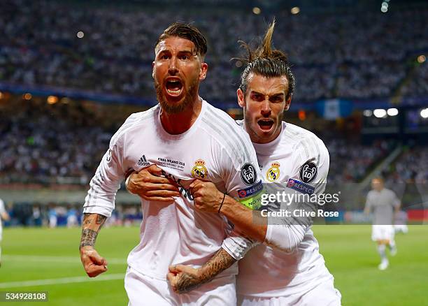 Sergio Ramos of Real Madrid celebrates with Gareth Bale after scoring the opening goal during the UEFA Champions League Final match between Real...