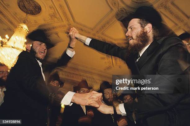 Hassidic men dance at a wedding celebration in the Crown Heights section of Brooklyn.