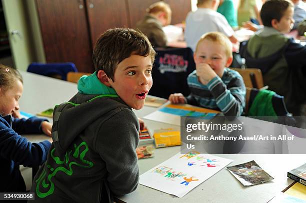 Belgium, Asse, Basisschool Vijverbeek, Art in All of Us Awareness program activities in scool, boy drawing