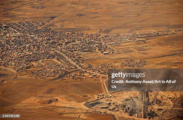 Bolivia, Inland, aerial view of congested residential structures amid barren landscape