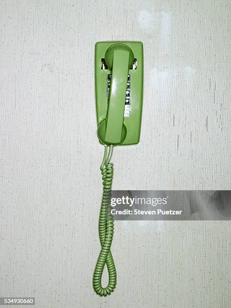 green phone on wall - phone receiver stock pictures, royalty-free photos & images