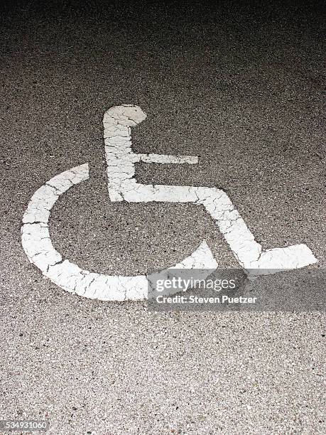 disabled symbol on pavement - handicap parking space stock pictures, royalty-free photos & images